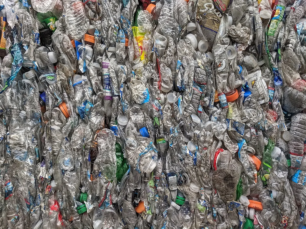 A bale of crushed PET plastic bottles ready for recycling