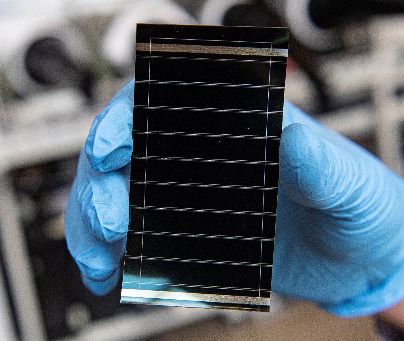 Solar panels and laboratory equipment under bright light